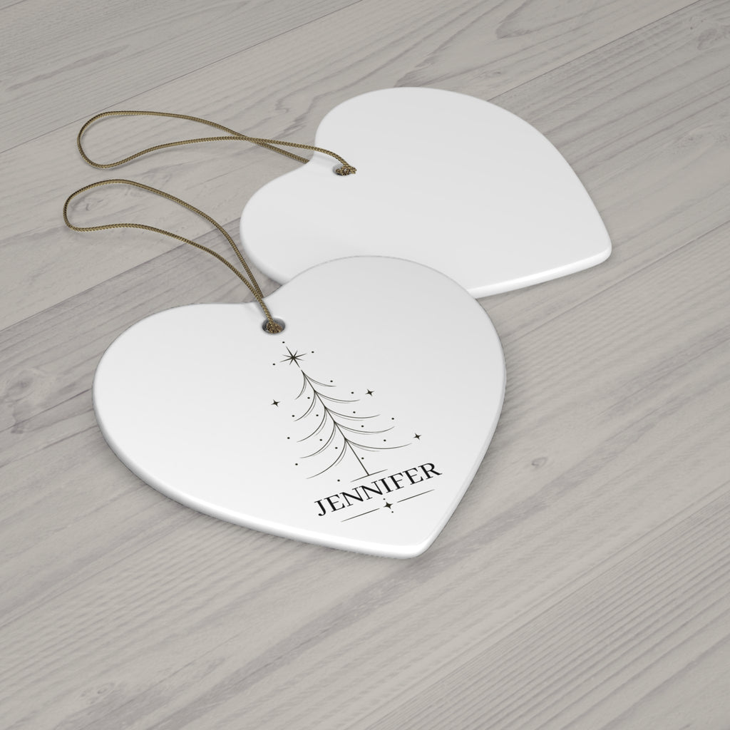 Heart Christmas tree name ornament with its blank back side on a wooden table