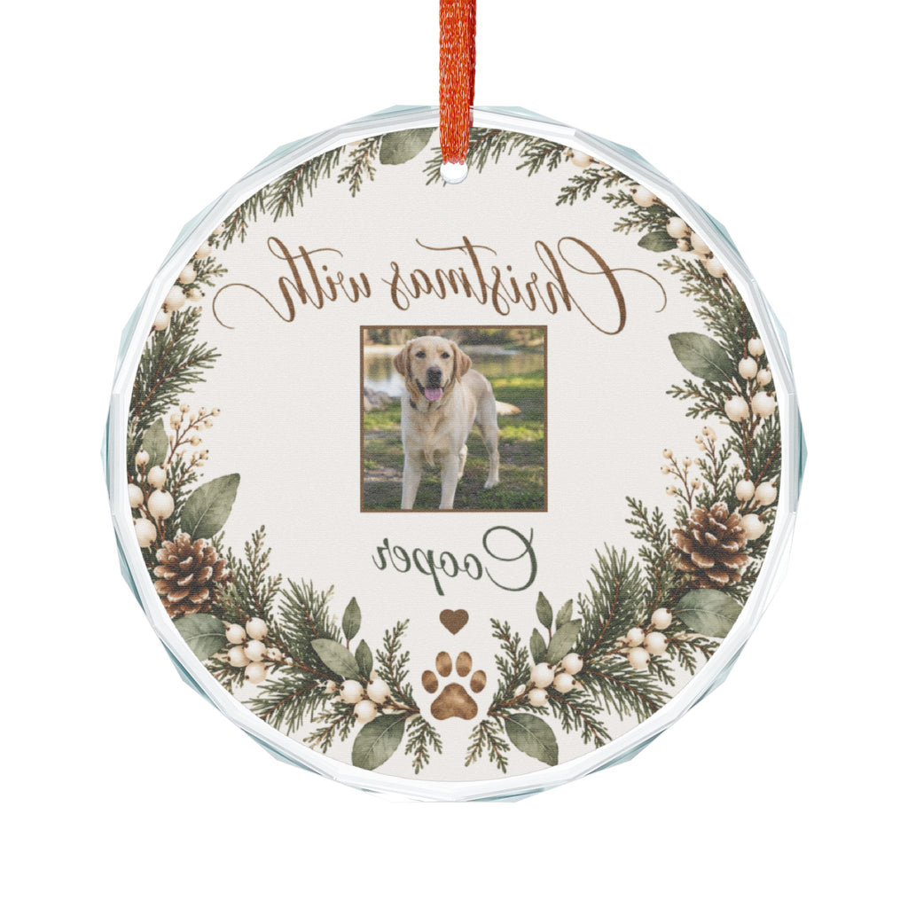 Round glass pet ornament seen from the back, showing the clear prism-cut edge