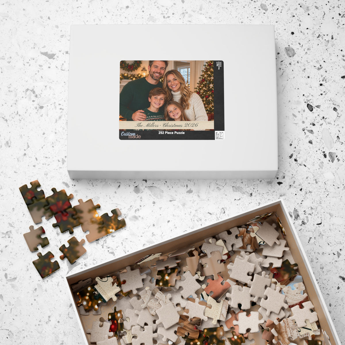 Gift box for the personalized photo puzzle with a tray of loose pieces