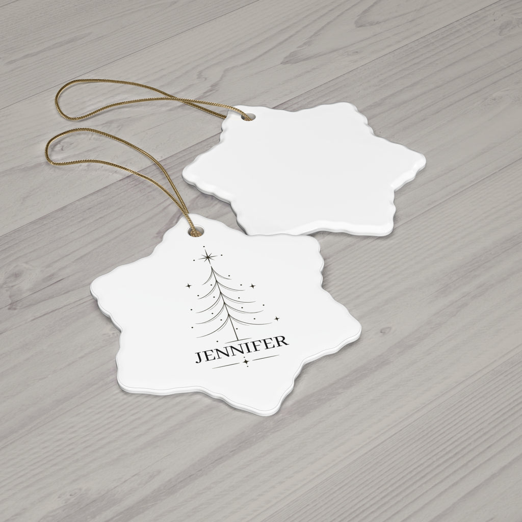 Snowflake Christmas tree name ornament with its blank back side on a wooden table