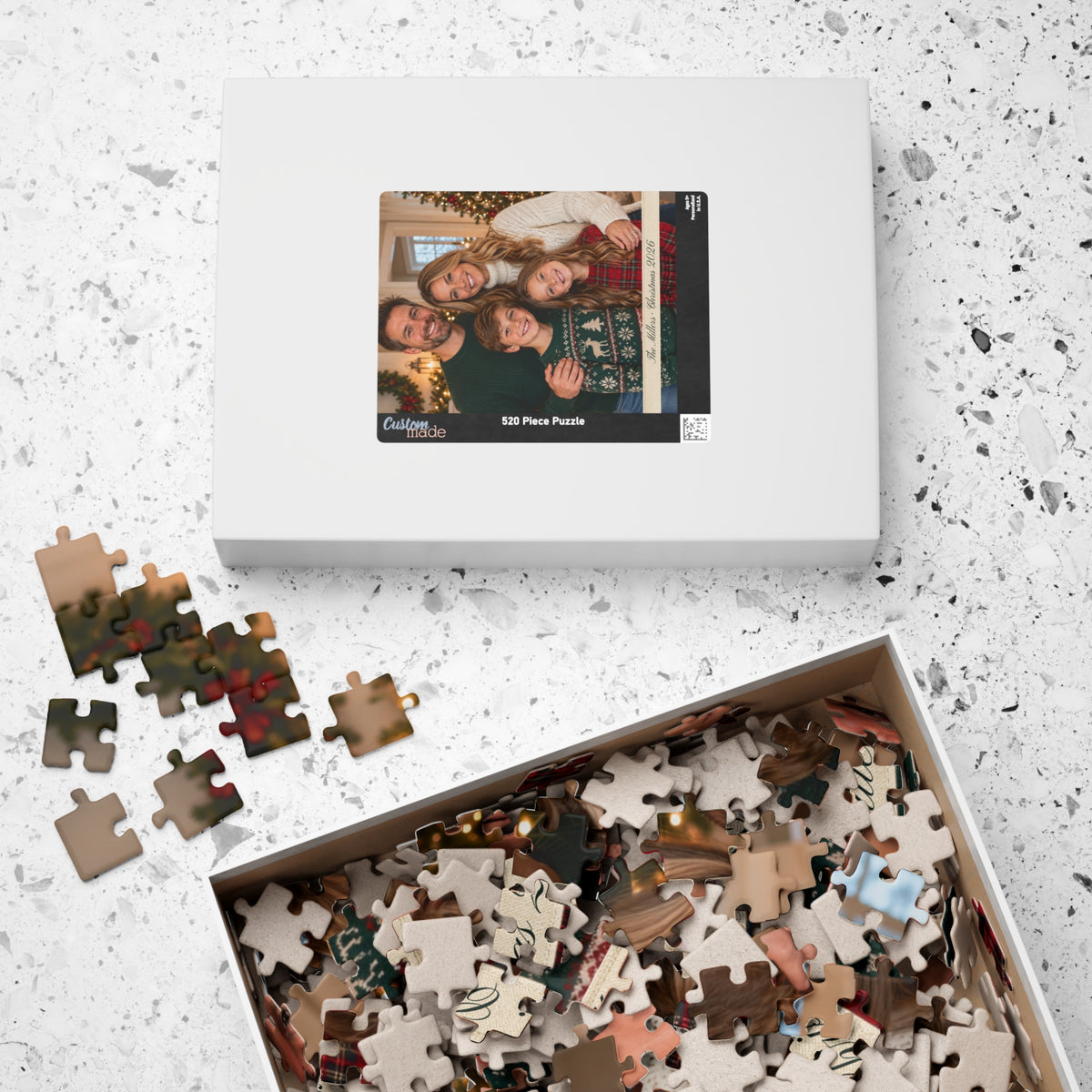 Puzzle box with the photo on the lid and a box of loose pieces