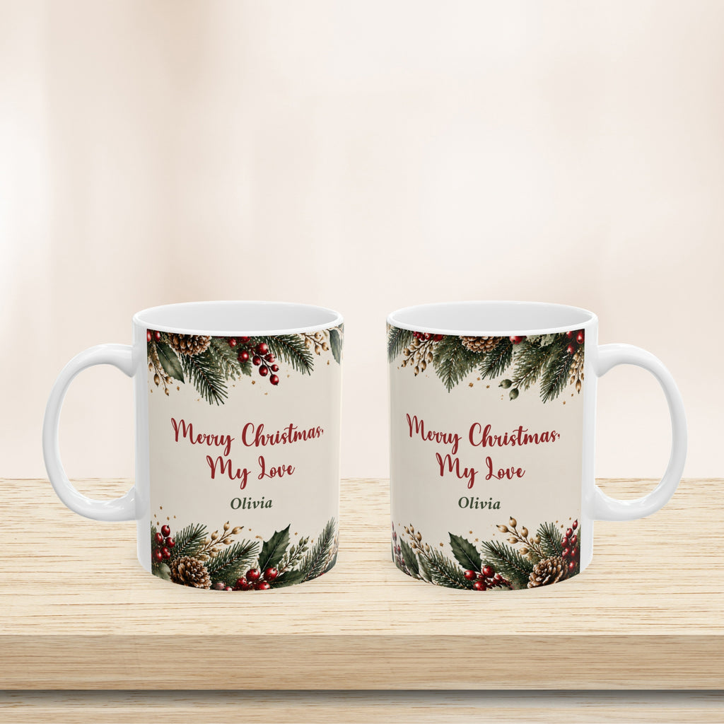 11 oz and 15 oz Merry Christmas My Love mugs side by side on a wooden shelf
