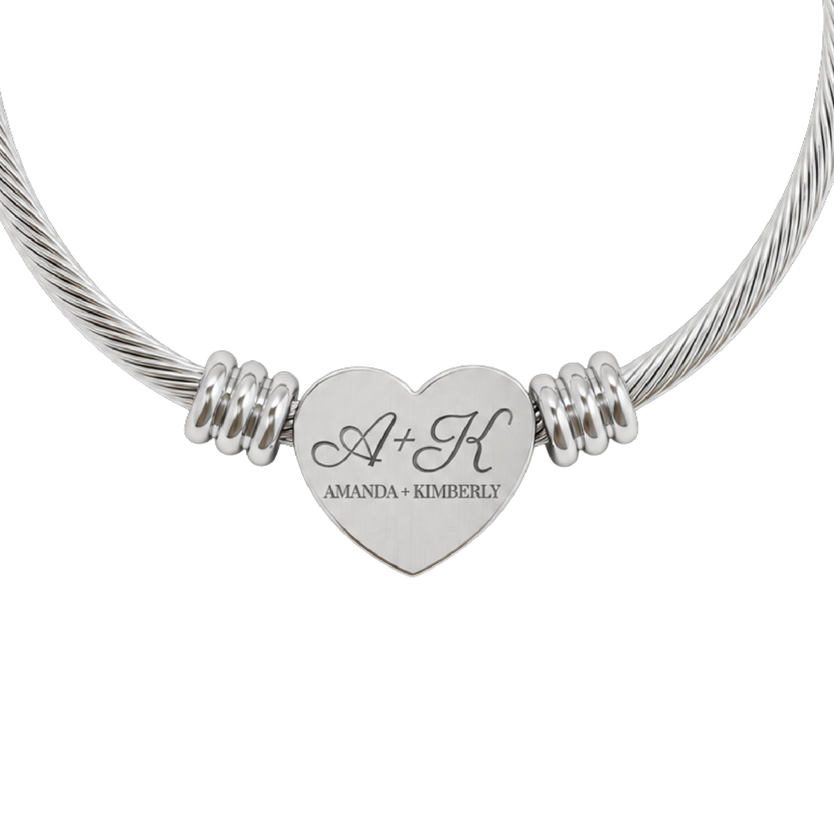 Best friend heart cuff bracelet in silver stainless steel, heart charm engraved with two initials and both names, close-up