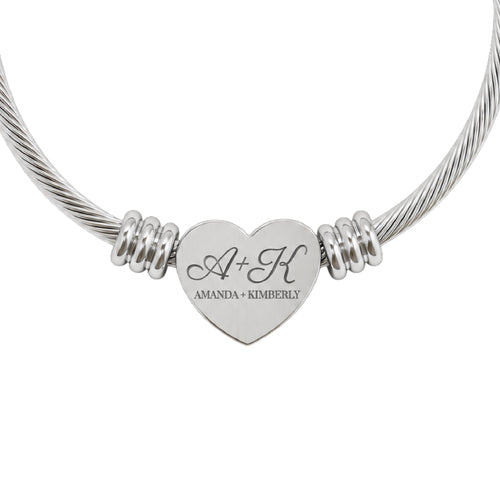 Best friend heart cuff bracelet in silver stainless steel, heart charm engraved with two initials and both names, close-up