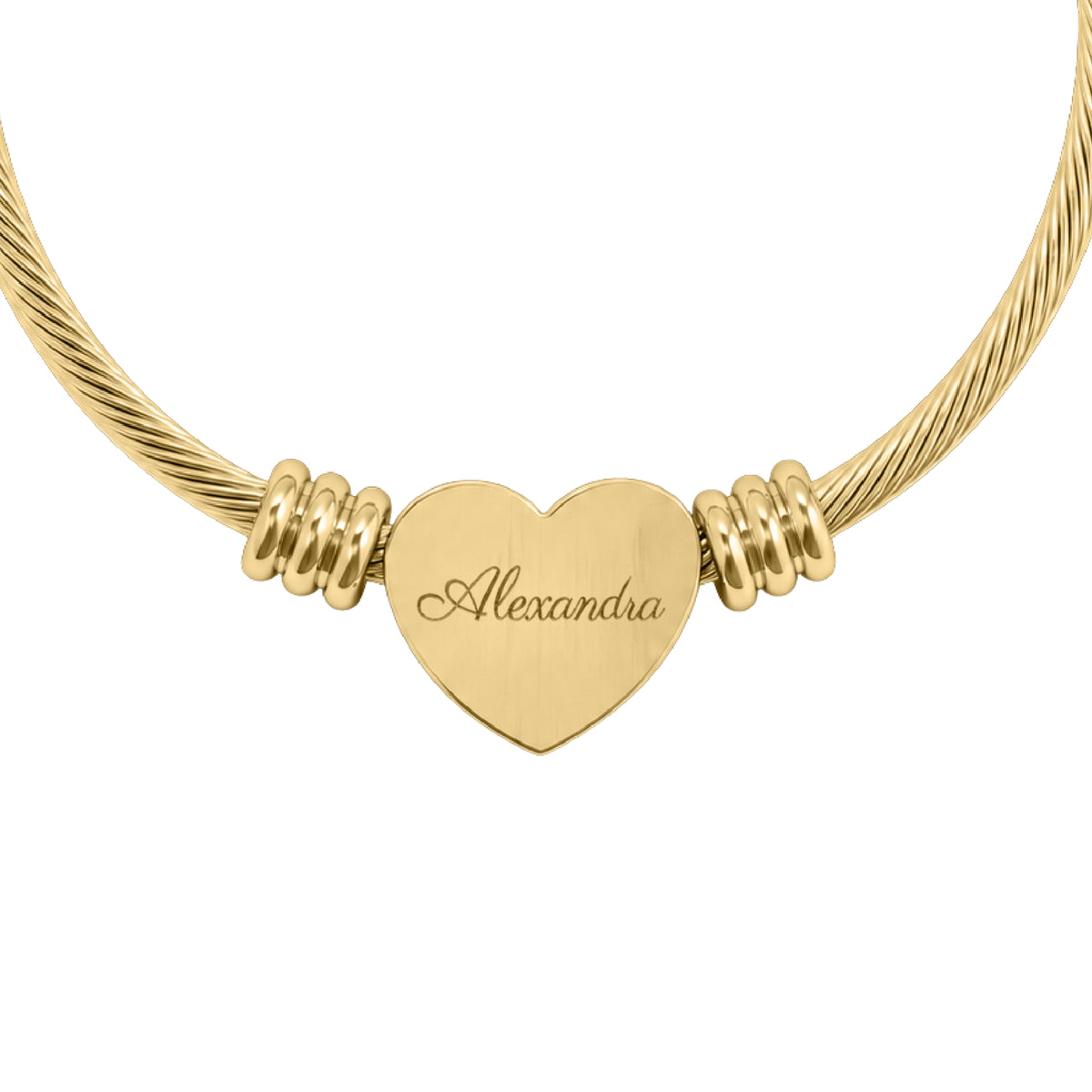 Personalized name heart cuff bracelet in gold finish, heart charm engraved with a name in script, close-up