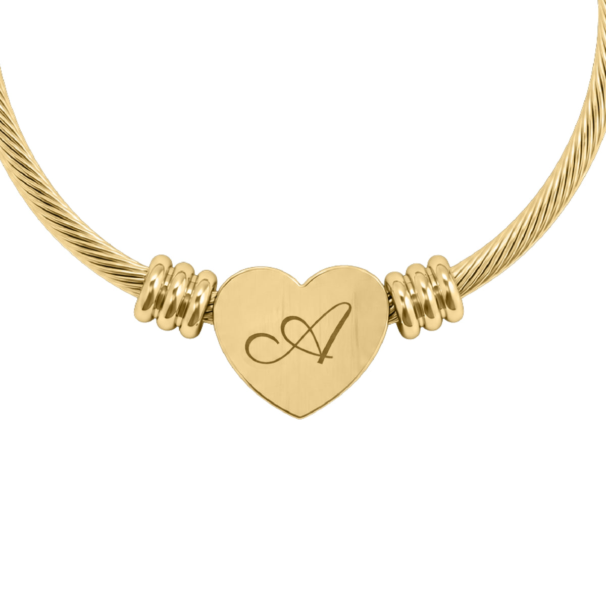 Personalized initial heart cuff bracelet in gold finish, heart charm engraved with a script initial A, close-up