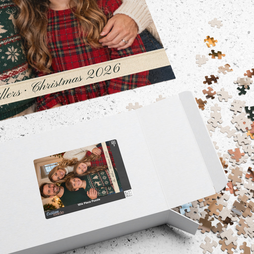 Photo puzzle box with the family photo on the lid next to loose pieces