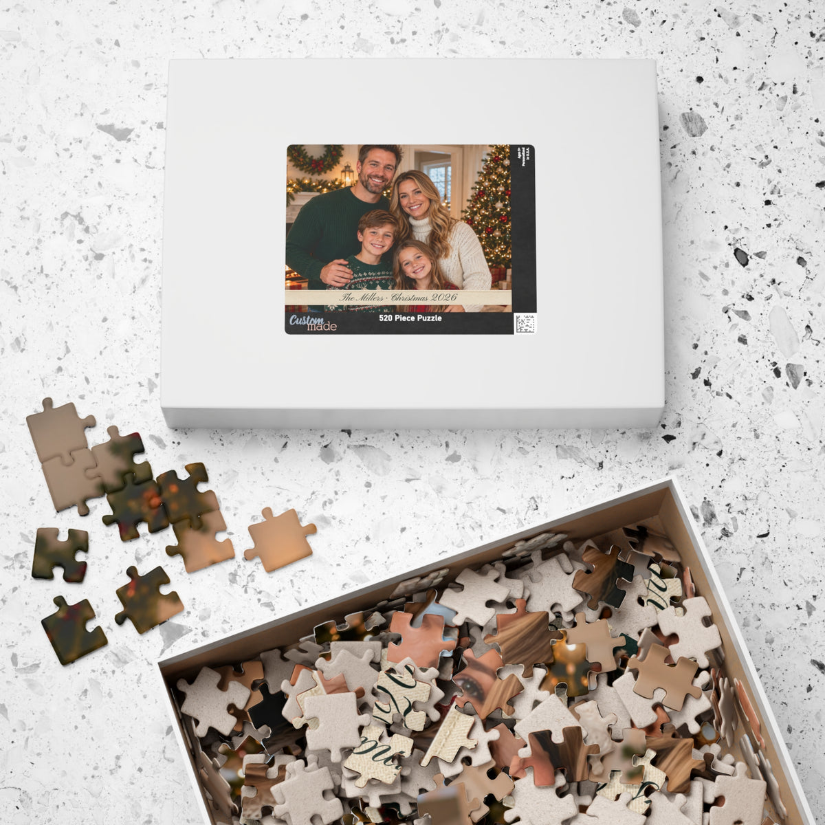 Photo puzzle box with the family photo on the lid and a tray of pieces