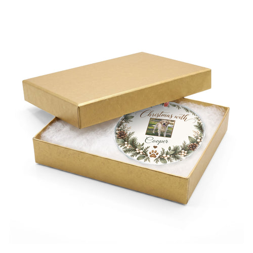 Round pet photo glass ornament in an open gold gift box