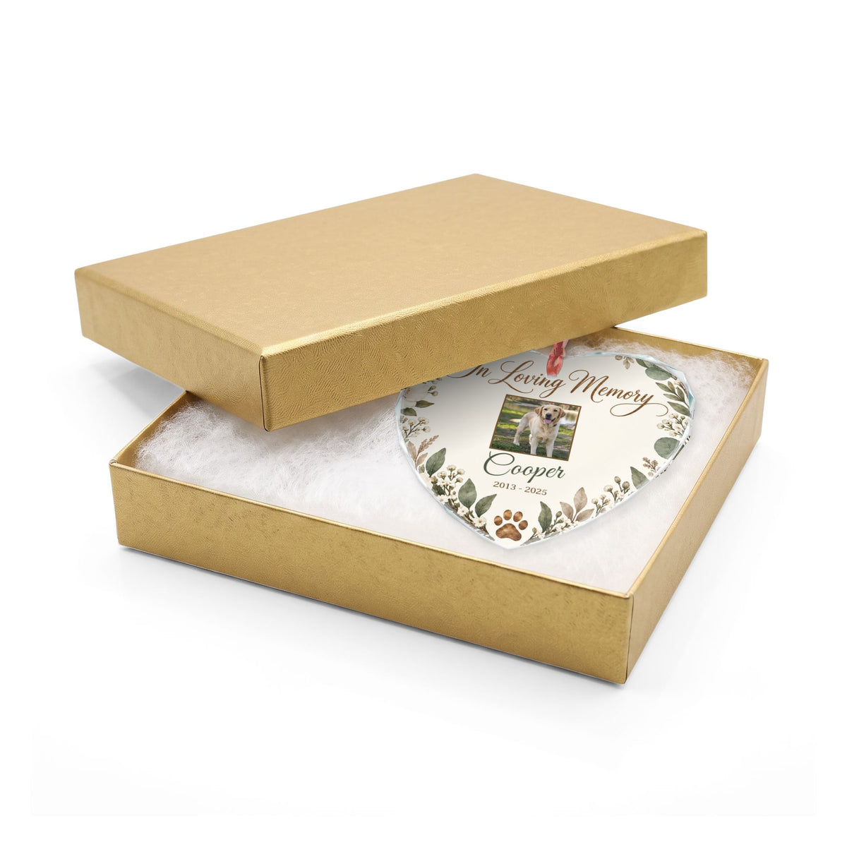 Heart-shaped pet memorial ornament in an open gold gift box