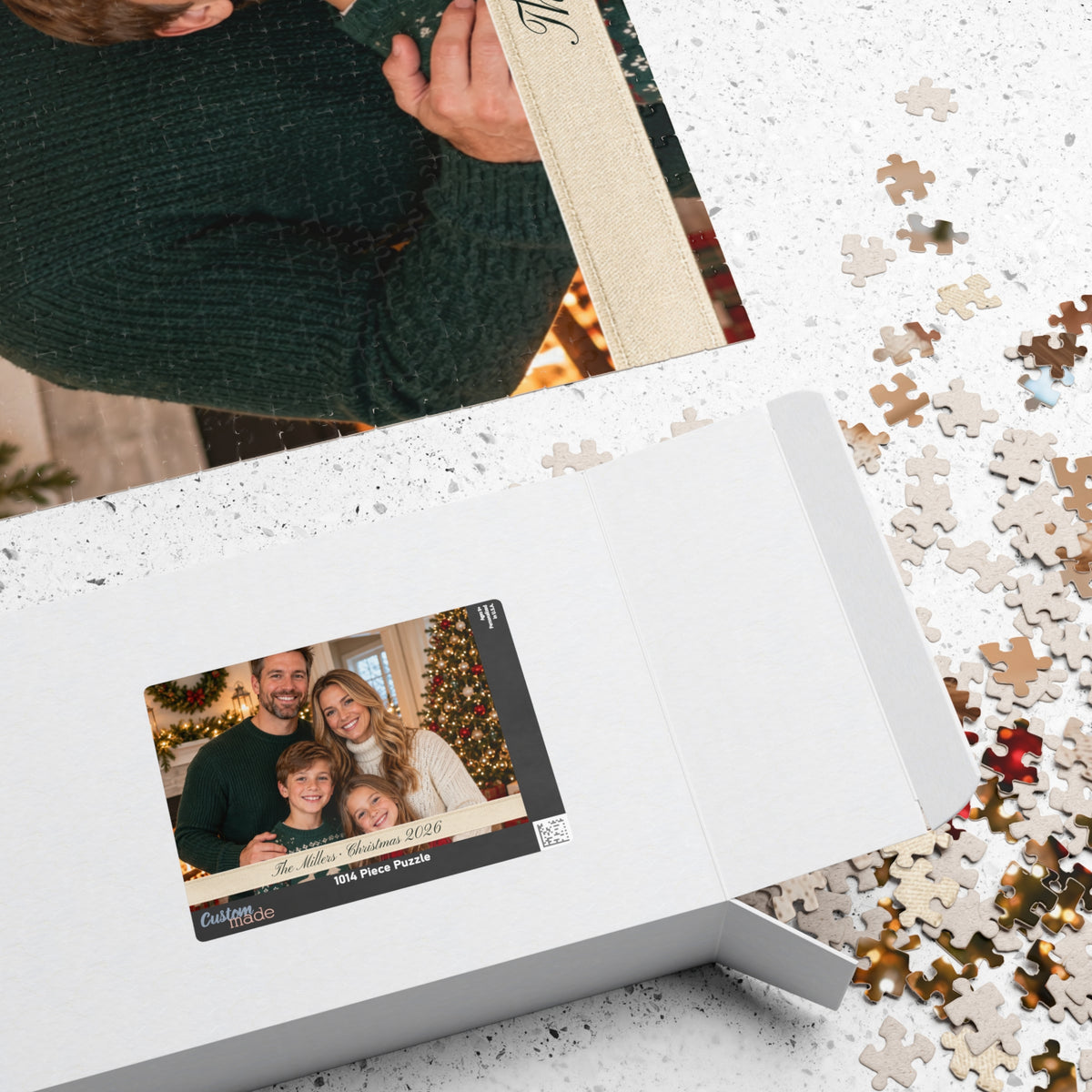 Personalized photo puzzle box beside the completed family puzzle