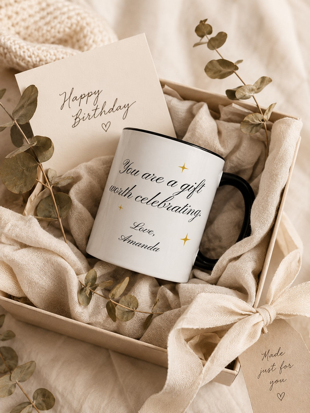 Personalized birthday mug presented as a wrapped gift with cream linen and dried eucalyptus